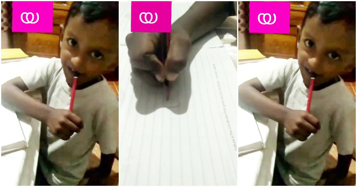 A little boy teach us to write malayalam alphabet